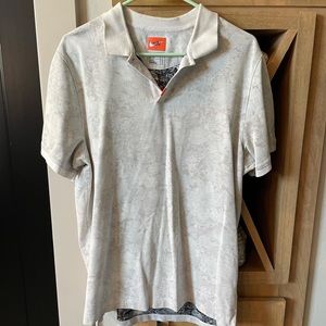 Men’s Nike Golf Polo Dri-Fit size LG, stone wash with print.